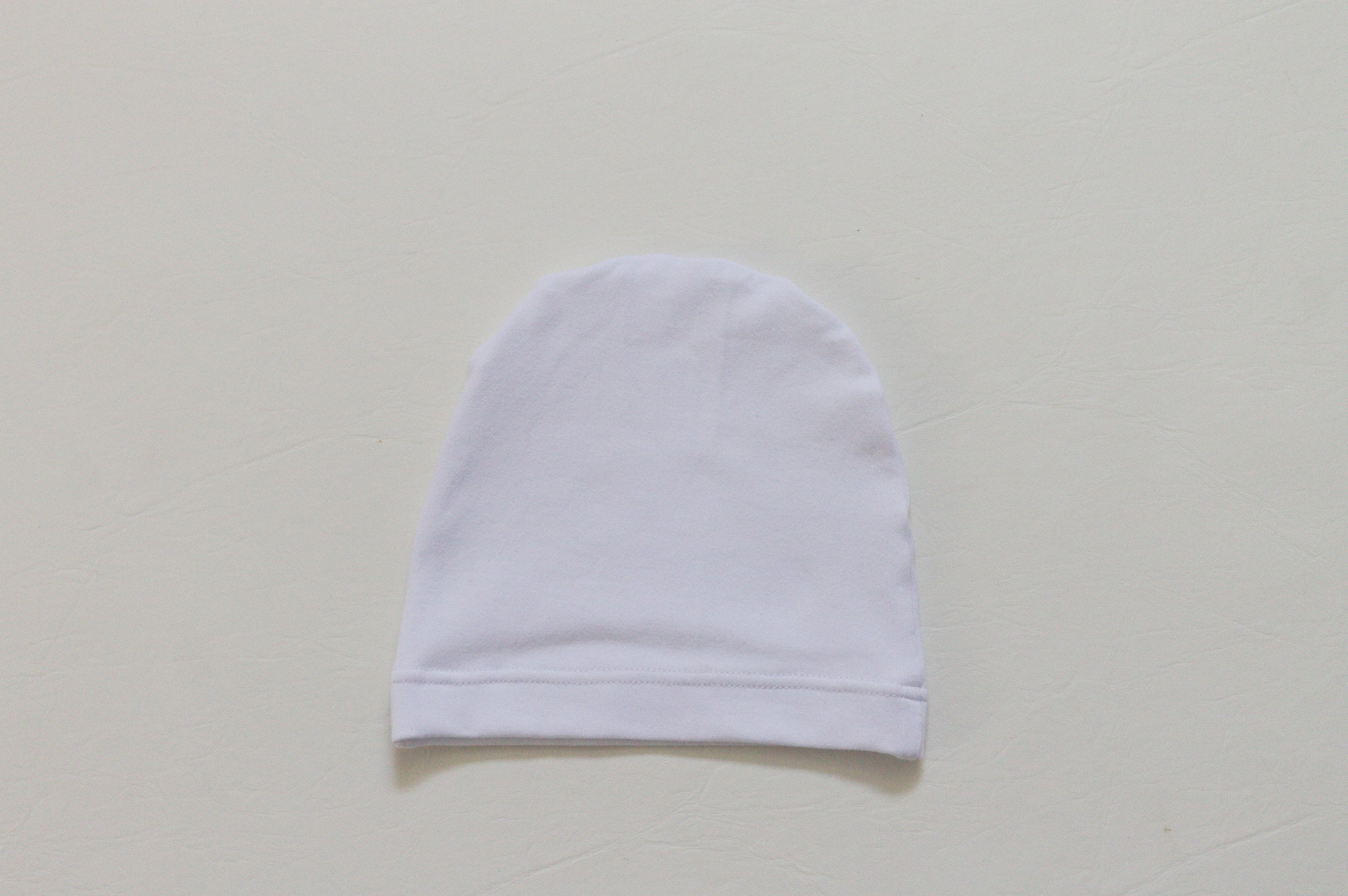 white infant beanie hat