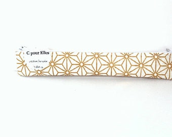 Gold and white toothbrush case