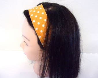 Woman with yellow dots orange headband