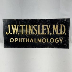 Vintage 2-Sided Hanging Eye Dr. Sign