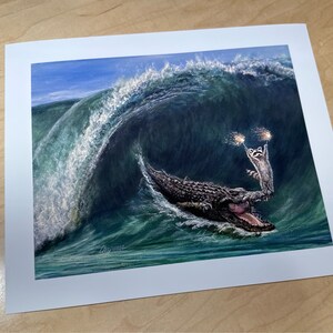 My wave raccoon surfing on a large alligator sea Croc. Artist signed print. Multiple variations. Great gift for raccoon fans. Kip and Cyrus image 3