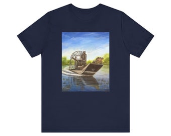 Raccoon and alligator riding in a fan boat airboat. Unisex Jersey Short Sleeve Tee