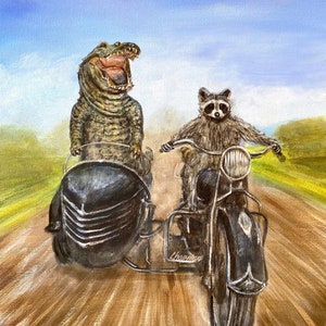 A raccoon and an alligator go for a ride on a motorcycle with a Sidecar. Kip and Cyrus go for a joyride. Artist signed print. Great gift!