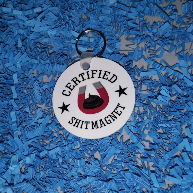 Certified shit magnet 2 round keychain