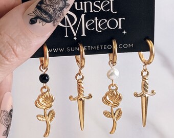 Mismatched dagger and rose hoops earrings . Unisex black onyx white freshwater pearl sword & rose earrings huggies . Long gold steel  hoops