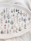 Charms for huggies in silver steel no tarnishing . Single hanging mismatched pendants for mix and match hoops. product logo