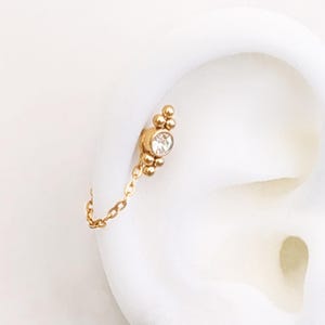 Gold simple piercing chain . Stainless steel waterproof helix conch chain . Earring chain for double huggies or earrings studs