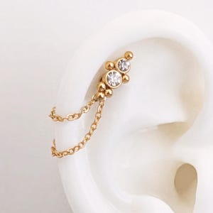 Doppia catena per piercing a conchiglia elica in acciaio inossidabile dorato. Gioielli a catena per orecchini a cerchio piercing o collegati