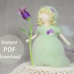 May include: A felt doll with blonde hair and a green dress, holding a lavender flower. The doll has a light purple flower on her dress and a white halo. The doll is sitting on a white crocheted surface. Instant PDF download.