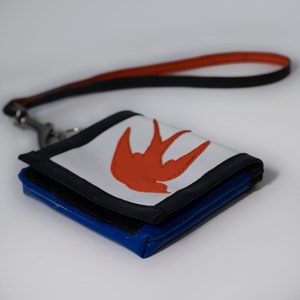 truck tarp wallet with a swallow on it
