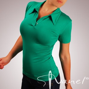 May include: A bright green short-sleeved collared shirt with a button closure. The shirt is made of a soft, stretchy fabric and has a fitted silhouette.