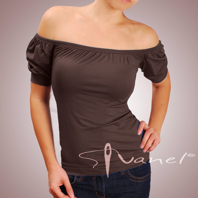 May include: A brown off-the-shoulder top with short sleeves. The top is made of a soft, stretchy fabric and has a relaxed fit.