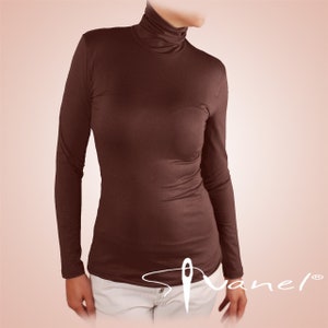 May include: A brown long-sleeved turtleneck shirt. The shirt is made of a soft, stretchy fabric and has a fitted silhouette.