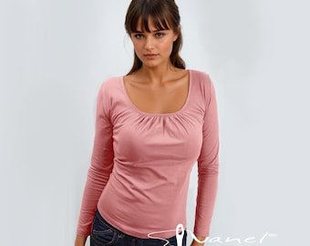 May include: A long-sleeved, pink scoop neck shirt with a gathered detail at the neckline. The shirt is fitted and has a casual, relaxed look.