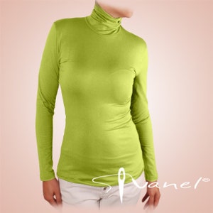 May include: A lime green long-sleeved turtleneck shirt. The shirt is made of a soft, stretchy fabric and has a fitted silhouette.