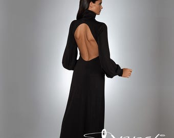 May include: A long black dress with a high turtleneck and long sleeves. The dress features a dramatic open back design. The sleeves are loose and gathered at the wrists. The dress is floor-length and made of a flowing fabric.