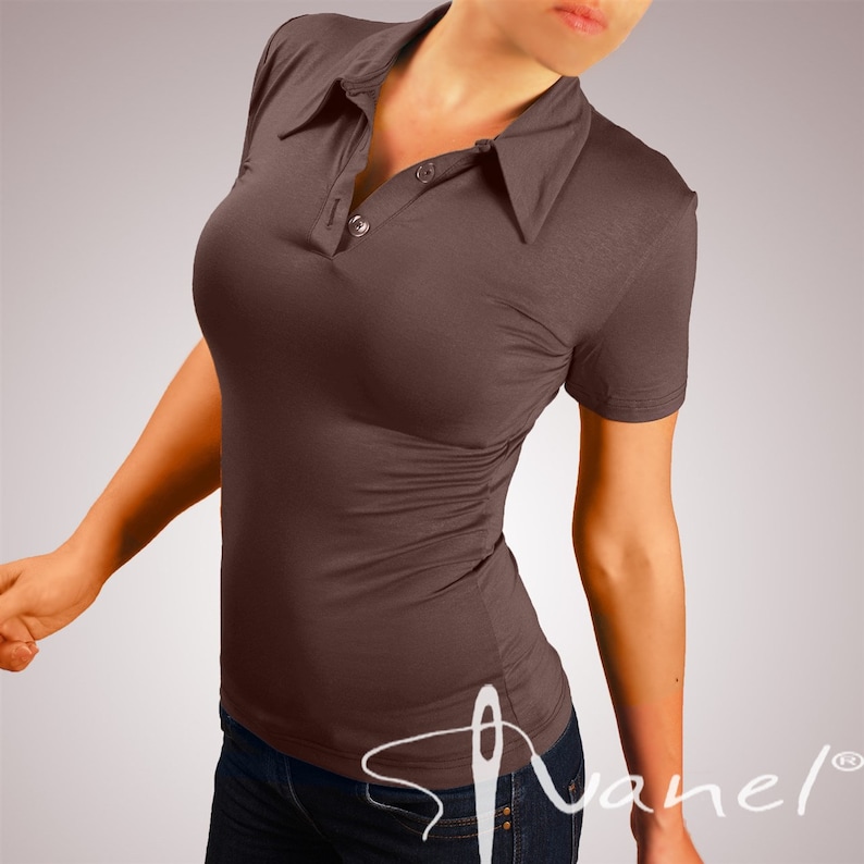 May include: A brown short-sleeved collared shirt with a button closure. The shirt is fitted and has a slightly gathered look.