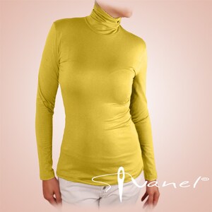 May include: A bright yellow long-sleeved turtleneck shirt.