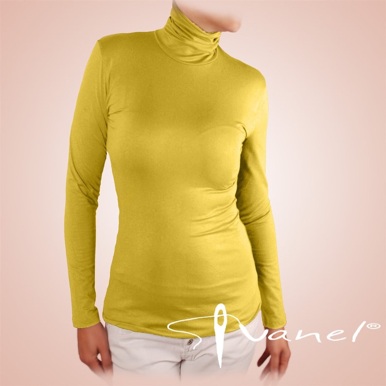 May include: A bright yellow long-sleeved turtleneck shirt.