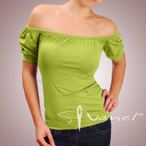 May include: A lime green off-the-shoulder top with short sleeves. The top is made of a soft, stretchy fabric and has a relaxed fit.