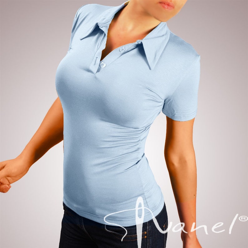 May include: A light blue collared shirt with a button closure. The shirt is fitted and has short sleeves.