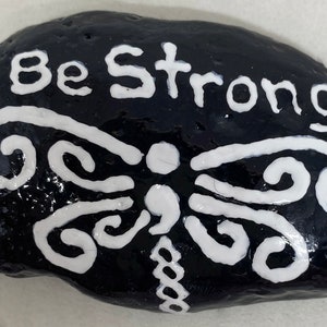 This semicolon white dragonfly on black is captioned, "Be Strong", in sympathy w/the Semicolon Project, fighting against suicide & self-harm