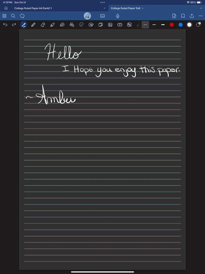 May include: A digital image of a dark gray college-ruled paper with handwritten text in white ink. The text reads "Hello", "I Hope you enjoy this paper.", and "~Amber". The paper has horizontal lines in various colors.