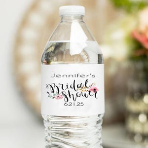May include: Water bottle label with a floral design and the text "Jennifer's Bridal Shower 6.21.25".