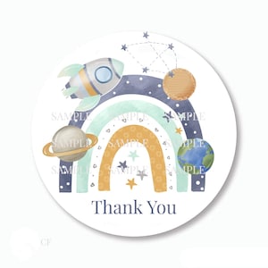 May include: Round thank you sticker with a rainbow, stars, planets, and a rocket ship. The text "Thank You" is in the center of the sticker.