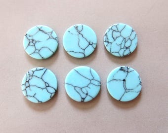 May include: Six round turquoise cabochons with black veining. The cabochons are approximately 2.5 cm in diameter.