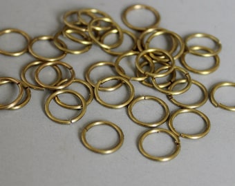 30 gramos, aproximadamente 600 piezas de anillos de salto redondos de latón crudo, hallazgos de 6 mm x 0,5 mm - F251