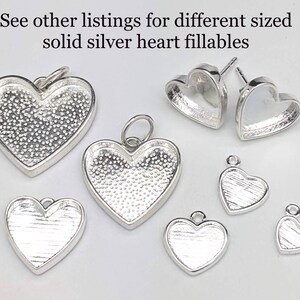 May include: Assortment of silver heart-shaped pendants and earring findings.  See other listings for different sized solid silver heart fillables.