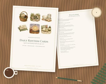 May include: Two white cards with illustrations of a basket, boots, kitchen items, books, a lantern, and pillows. The text reads Wildwood Intentions Daily Rhythm Cards, a gentle visual rhythm for little ones, ages 2 to 6, and What's Inside.