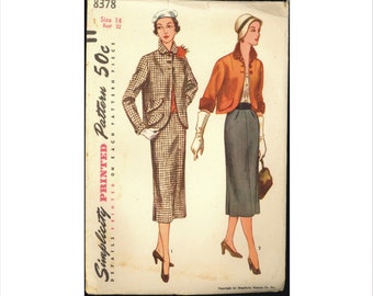 May include: Vintage Simplicity sewing pattern for a two-piece outfit. The pattern is for size 14, bust 32. The pattern shows a woman wearing a plaid skirt suit and a woman wearing a solid skirt and jacket. The pattern is printed on each pattern piece. The pattern is 50 cents.