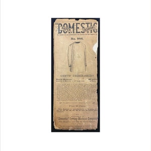 May include: A vintage sewing pattern for a men's undershirt. The pattern is printed on a yellowed piece of paper with a black and white illustration of the garment. The pattern is labeled "No. 986" and includes the text "Gents' Under-Shirt", "Breast Measure, 38 inches", "Quantity of Material, 3 Yards", and "Price 35 Cents". The pattern is from the "Domestic Sewing Machine Company" in New York.