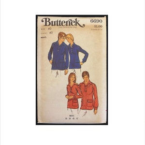 May include: A vintage sewing pattern for a shirt, featuring two models wearing different versions of the shirt. The pattern is from Butterick, the Fashion One, and is number 6690. The shirt is available in sizes 36, 38, 40, and 42.