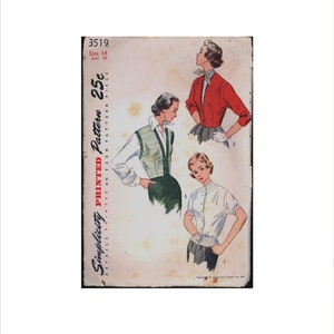 May include: A vintage Simplicity sewing pattern for a blouse with a 25 cent price tag. The pattern is for size 14, bust 32. The pattern shows three different styles of blouses, one with a red cardigan, one with a striped vest, and one with a white blouse with a collar.