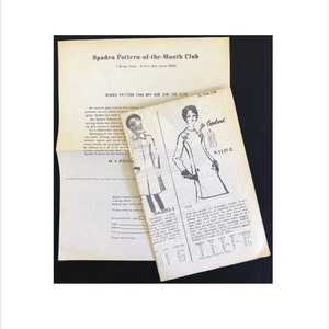 May include: A black and white image of a sewing pattern for a coat. The pattern is called "N-1137-2" and is from the Spadea Pattern-of-the-Month Club. The image also includes a smaller image of a woman wearing the coat.