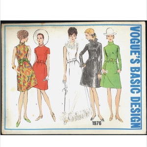 May include: A vintage sewing pattern from Vogue's Basic Design, featuring five different dress designs. The pattern is from 1976 and includes a white dress with a feathered trim, a red dress, a green dress, a black dress, and a colorful patterned dress.