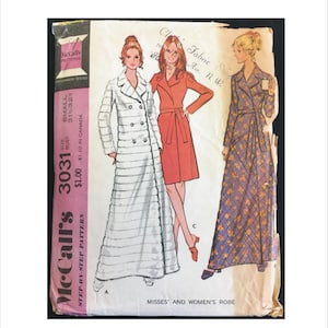 May include: McCall's sewing pattern for a misses' and women's robe. The pattern includes three different styles: a white robe with a double-breasted closure, a red robe with a sash, and a floral robe with a sash. The pattern is for sizes small, medium, and large.