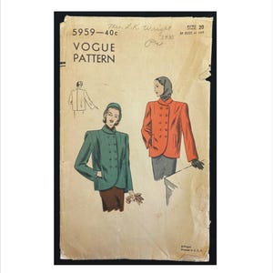 May include: Vintage Vogue pattern featuring illustrations of double-breasted jackets in green and orange. The pattern includes the text "VOGUE PATTERN" and handwritten notes. The pattern is size 20, with a 38-inch bust and 41-inch hip.