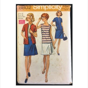 May include: Vintage Simplicity sewing pattern number 8802 for women's clothing. The pattern includes three different styles: a red jacket with a blue skirt, a striped sleeveless dress with a white skirt, and a blue dress with a matching skirt. The pattern is for sizes 44, bust 48, waist 40. The pattern is priced at $1.00.