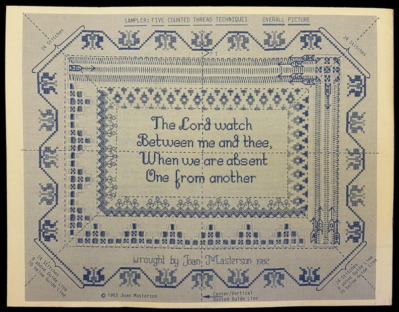 May include: A blue and white counted thread sampler with the text "The Lord watch Between me and thee, When we are absent One from another." The sampler includes decorative borders and the text "wrought by Joan Masterson 1982."