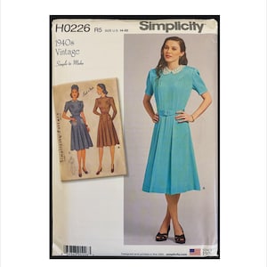 May include: Simplicity pattern H0226, featuring a vintage 1940s design. The image shows a teal dress with a white collar and belt, alongside a smaller image of the dress in different colors. The pattern size is US 14-22.