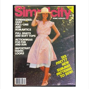May include: A magazine cover for Simplicity Home Catalog featuring a woman wearing a floral sundress and a straw hat. The cover text reads "Sundresses: Easy Pull-Ons and Romantics, Full Skirts and Soft Tops, Actionwear for Fun and Sun, Important Fabric Looks, 123 Pretty New Summer Patterns to Sew!"
