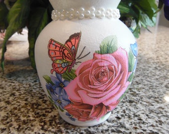 Roses and butterflies cover most of the decoupaged vase, hand painted and decorated vase