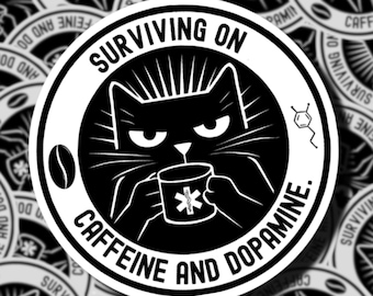 May include: A circular black and white sticker featuring a grumpy cat holding a mug with a medical symbol. The text reads SURVIVING ON CAFFEINE AND DOPAMINE. A coffee bean and a chemical structure icon are included in the circular border design.