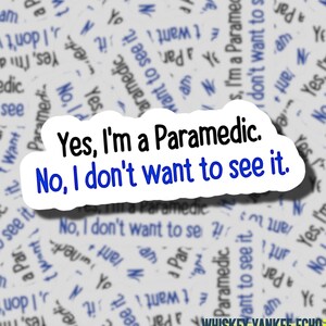 May include: A white sticker with the text "Yes, I'm a Paramedic. No, I don't want to see it." in black and blue. The sticker is surrounded by a background of similar text in blue.