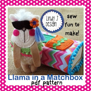 May include: A felt llama toy with a black mask, flower, and blue tassel, next to a colorful matchbox. The matchbox has a patterned fabric and a felt orange square. Text reads "Llama in a Matchbox pdf pattern" and "sew fun to make!"