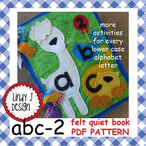 May include: A felt quiet book pattern for making a baby book with the alphabet letters a, b, and c. The book has a green background with a white llama, a blue bird, and a yellow lion. The book also has the text "abc-2 felt quiet book PDF PATTERN".